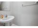 Half bathroom with pedestal sink and stylish faucet at 6068 Apple Snail Ave, New Port Richey, FL 34653