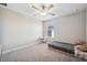 Bedroom features a ceiling fan and bright window overlooking the backyard at 6068 Apple Snail Ave, New Port Richey, FL 34653