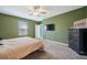 Spacious bedroom with a ceiling fan and natural light at 6068 Apple Snail Ave, New Port Richey, FL 34653