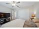 Cozy bedroom featuring a ceiling fan, closet and neutral wall color at 6068 Apple Snail Ave, New Port Richey, FL 34653