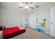 Bright bedroom features a bed, vanity, and closet, providing a functional and comfortable space at 6068 Apple Snail Ave, New Port Richey, FL 34653