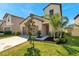 Charming home featuring a two-car garage and landscaped front yard at 6068 Apple Snail Ave, New Port Richey, FL 34653