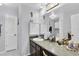 Bathroom with countertop, sink, and a large mirror at 6420 Cabbage Ln, New Port Richey, FL 34653