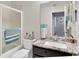 Bathroom features a walk-in shower, modern fixtures, and updated vanity at 6420 Cabbage Ln, New Port Richey, FL 34653