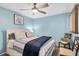Comfortable bedroom with a ceiling fan, providing a relaxing retreat at 6420 Cabbage Ln, New Port Richey, FL 34653