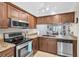 Well-equipped kitchen features stainless steel appliances and ample countertop space for meal preparation at 6420 Cabbage Ln, New Port Richey, FL 34653