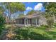 This home has a well-maintained yard, screened porch, and lush landscaping at 6530 Pine Meadows Dr, Spring Hill, FL 34606