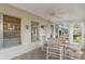 Enclosed lanai with ceiling fan and tile floor provides a great outdoor living area at 6530 Pine Meadows Dr, Spring Hill, FL 34606