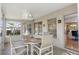 Enclosed lanai with ceiling fan and tile floor offers a comfortable outdoor living space at 6530 Pine Meadows Dr, Spring Hill, FL 34606