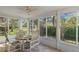Enclosed lanai with ceiling fan and tile floor offers great views of the outdoor foliage at 6530 Pine Meadows Dr, Spring Hill, FL 34606