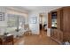 Cozy sitting area with a view to the bedroom and natural light from the window at 6530 Pine Meadows Dr, Spring Hill, FL 34606