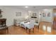 Spacious living room showcasing hardwood floors, a comfortable seating arrangement, and a welcoming ambiance at 6530 Pine Meadows Dr, Spring Hill, FL 34606