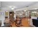 Spacious living room boasts hardwood floors, multiple seating areas, and an open layout to adjacent rooms at 6530 Pine Meadows Dr, Spring Hill, FL 34606