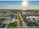 Aerial view of coastal neighborhood with waterfront homes and lush greenery at 6536 Beach Blvd, Hudson, FL 34667