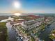 Expansive aerial view highlighting waterfront homes, canals, and ocean access, showing the property's desirable location at 6536 Beach Blvd, Hudson, FL 34667