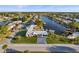 A picturesque view shows a waterfront home with a dock on a canal at 6536 Beach Blvd, Hudson, FL 34667