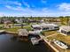 Waterfront house boasts an outdoor gazebo, dock, boat lift, and lush landscaping at 6536 Beach Blvd, Hudson, FL 34667
