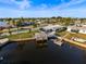 Waterfront home featuring a dock and boat lift for easy access to waterway at 6536 Beach Blvd, Hudson, FL 34667