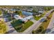 Waterfront home with canal access, a dock, and verdant landscaping at 6536 Beach Blvd, Hudson, FL 34667