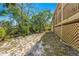 A charming backyard featuring ample green space and a scenic wooded area at 7240 Creek Dr, New Port Richey, FL 34655