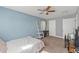 Light and airy bedroom features a ceiling fan, carpet and an inviting atmosphere at 7240 Creek Dr, New Port Richey, FL 34655