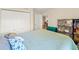 Bright bedroom with large windows and ample closet space, featuring a comfortable bed with decorative pillows at 7240 Creek Dr, New Port Richey, FL 34655