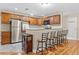 Updated kitchen with stainless steel appliances, breakfast bar, and plenty of seating at 7240 Creek Dr, New Port Richey, FL 34655