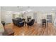Spacious living room with hardwood floors, leather furniture, and natural light at 7240 Creek Dr, New Port Richey, FL 34655