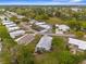 Aerial view of a well-maintained residential community with tree-lined streets at 7506 Moriah Ave, Brooksville, FL 34613