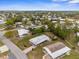 Overhead view showcasing a delightful home with mature trees and landscaping in a tranquil residential community at 7506 Moriah Ave, Brooksville, FL 34613