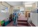Carpeted bonus room with window, storage, and access to the enclosed porch at 7506 Moriah Ave, Brooksville, FL 34613