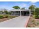 Charming single-story home featuring a covered carport and well-maintained landscaping at 7506 Moriah Ave, Brooksville, FL 34613