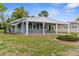 Well-maintained single-story home with a covered carport and tidy landscaping at 7506 Moriah Ave, Brooksville, FL 34613