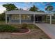 Attractive single-story home with covered parking and manicured landscaping at 7506 Moriah Ave, Brooksville, FL 34613