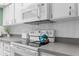 This kitchen showcases white appliances and ample counter space at 7506 Moriah Ave, Brooksville, FL 34613