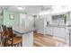 Kitchen featuring a breakfast bar and white cabinets at 7506 Moriah Ave, Brooksville, FL 34613