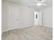 Bright bedroom with two doors and neutral carpeting at 778 Parsons Mooring Ct, Seffner, FL 33584