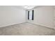 A large bedroom with carpet and a window with curtain at 778 Parsons Mooring Ct, Seffner, FL 33584