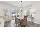 Cozy dining area featuring a stylish chandelier and access to the outdoor living space at 778 Parsons Mooring Ct, Seffner, FL 33584