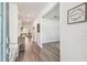 Inviting foyer with hardwood flooring, a storage bench, and an open view of the home's layout at 778 Parsons Mooring Ct, Seffner, FL 33584