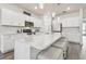 Well-lit kitchen featuring a large island with seating and stainless steel appliances at 778 Parsons Mooring Ct, Seffner, FL 33584