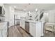 Spacious kitchen with stainless steel appliances, a large island, and modern pendant lighting at 778 Parsons Mooring Ct, Seffner, FL 33584