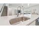 Close-up of kitchen island with stainless steel sink and modern faucet at 778 Parsons Mooring Ct, Seffner, FL 33584