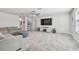 Large upstairs living area with neutral carpet, ceiling fan and natural light at 778 Parsons Mooring Ct, Seffner, FL 33584