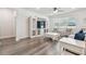 Cozy living room featuring stylish decor, an entertainment center, and ample seating at 778 Parsons Mooring Ct, Seffner, FL 33584