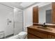 Bathroom featuring shower with glass doors, newer vanity, sink, fixtures, toilet and tile floors at 8364 Eldridge Rd, Spring Hill, FL 34608