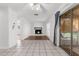 Spacious living room with tile floors, fireplace, and sliding doors that bring in natural light at 8364 Eldridge Rd, Spring Hill, FL 34608