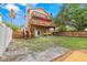 Spacious backyard with multi-level wood decks on home and a well-maintained lawn and landscaping at 856 Wisconsin Ave, Palm Harbor, FL 34683