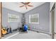 A bedroom with exercise equipment, natural light, and ample workout space at 856 Wisconsin Ave, Palm Harbor, FL 34683