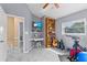 A bedroom and workout area with adjacent bathroom and stairwell access at 856 Wisconsin Ave, Palm Harbor, FL 34683